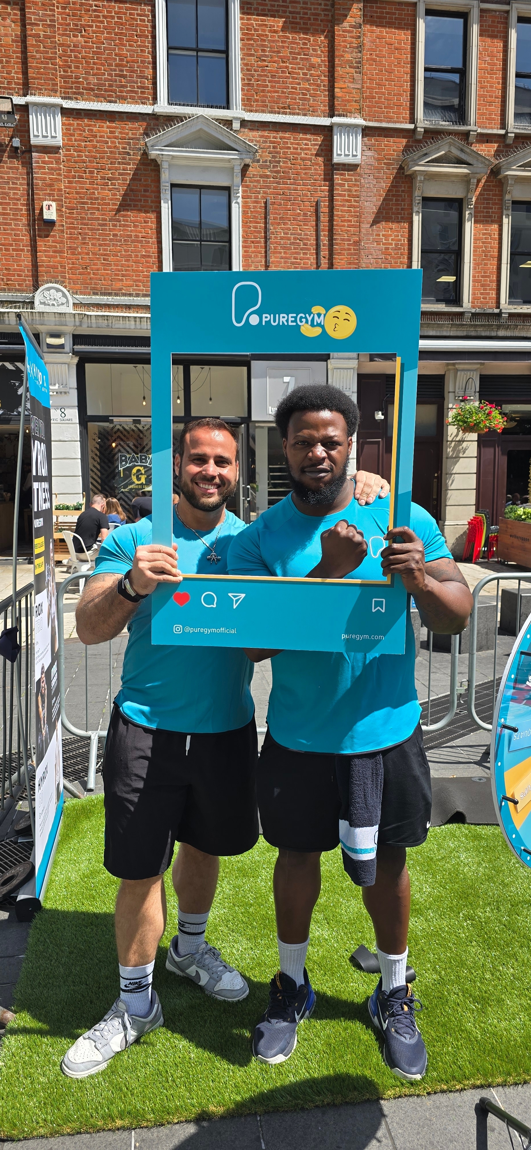 Coach André guiding a client through proper rowing form